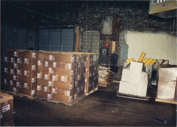Palates of boxes stacked in a basement